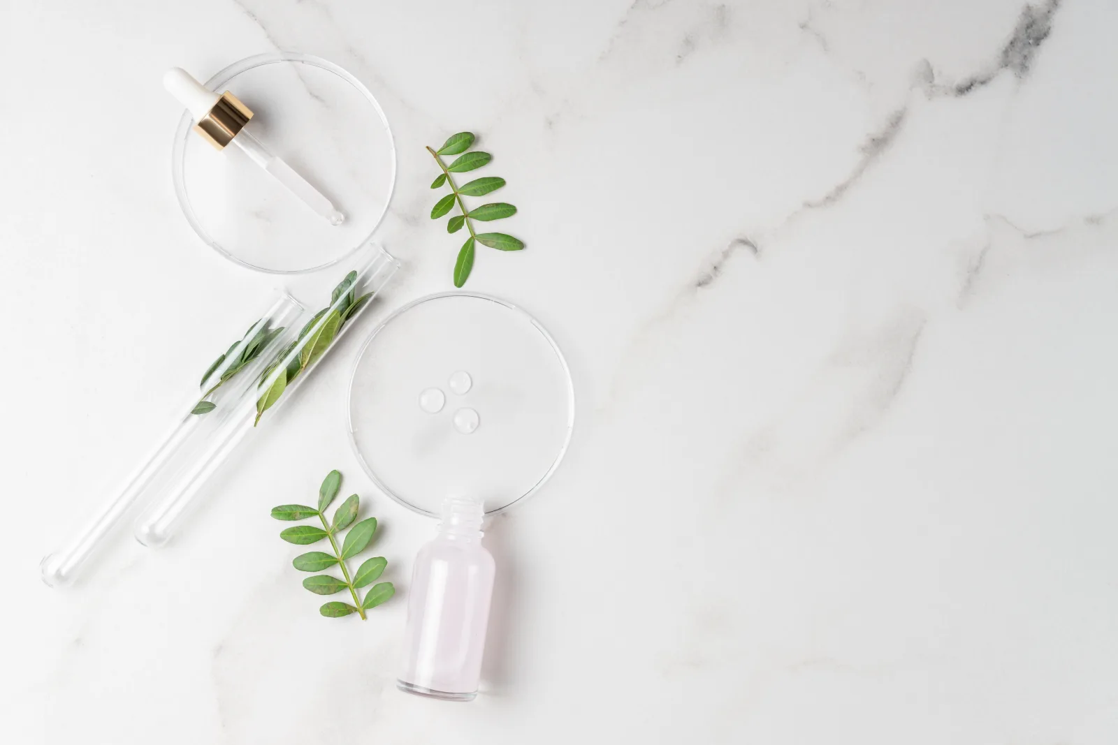 Independent lab testing — glassware and samples on a clean marble surface